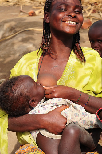 African Women Breastfeeding Animals