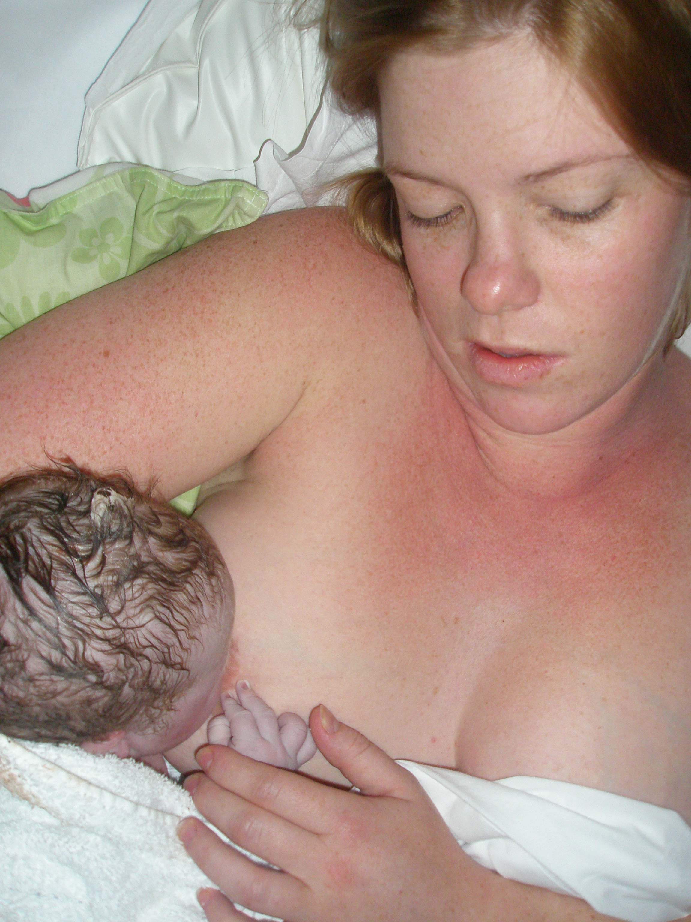 Women Breastfeeding Husband